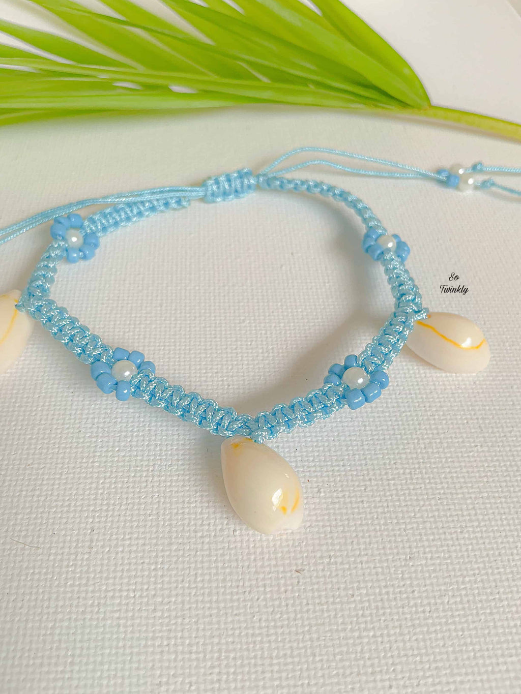 Handmade shell anklet with seashells, sky blue nylon cord, and acrylic pearls