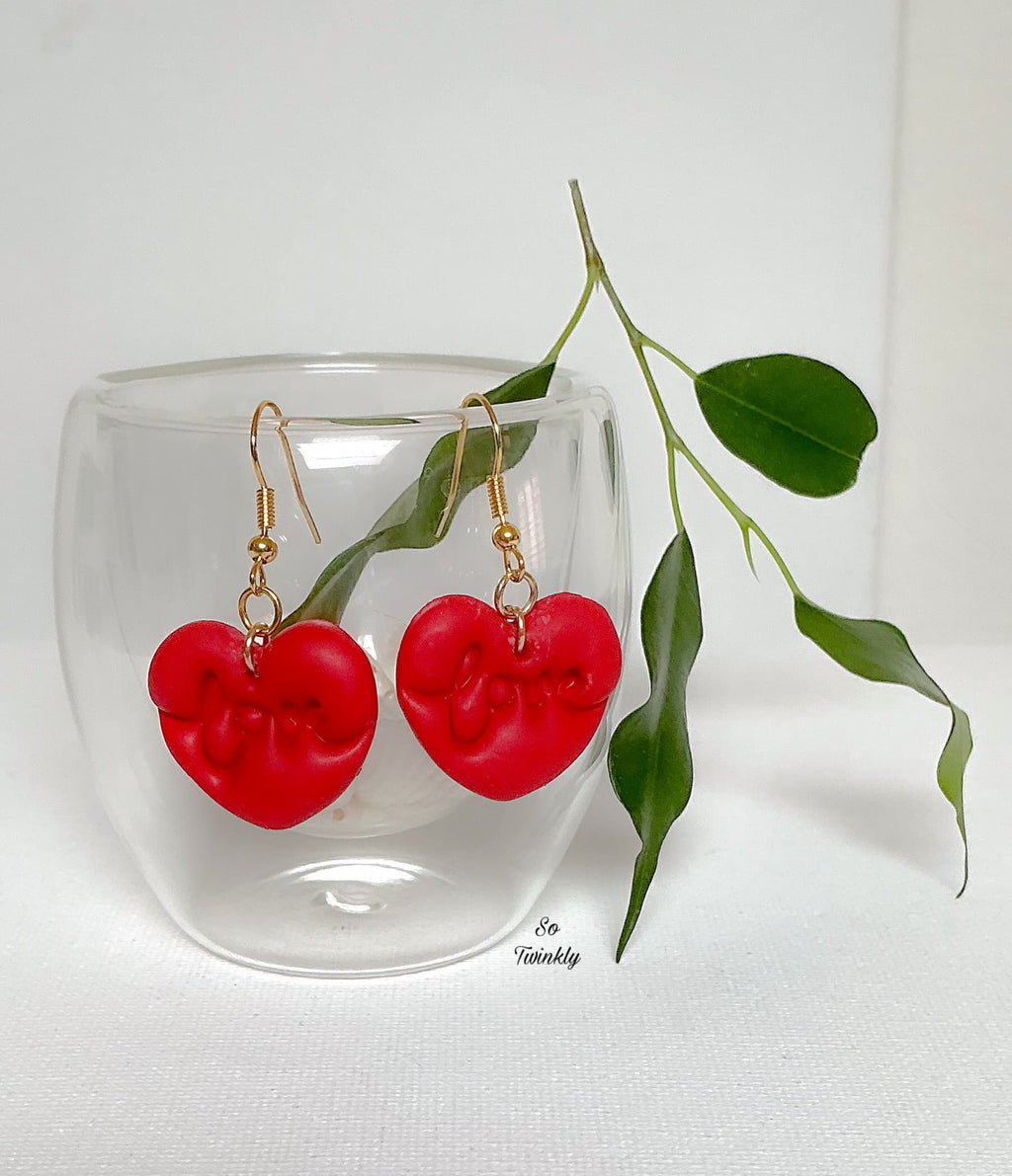 Handmade romantic earrings made from polymer clay with delicate details and iron hook